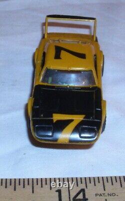 AURORA AFX #7 DODGE DAYTONA SUPERBIRD VOITURE DE COURSE HO SLOT CAR DES ANNÉES 1970 EN JAUNE BEAU